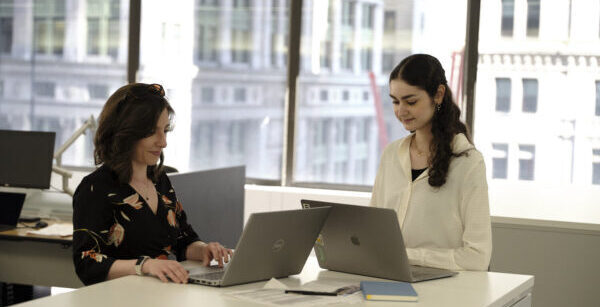 Two staff members working in NYC office