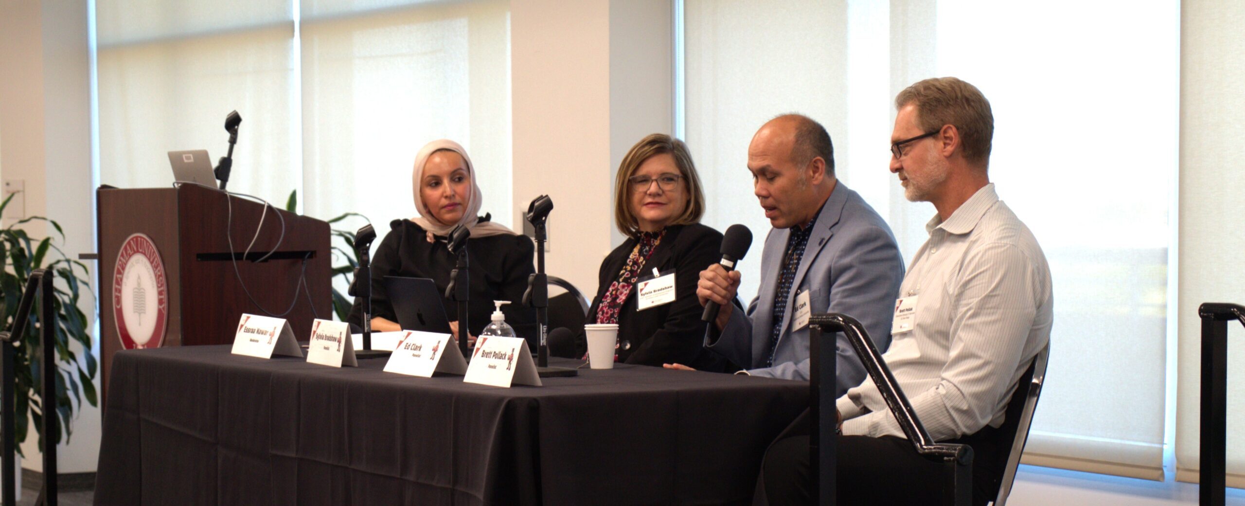 Panel featuring speakers Essraa Nawar, Sylvia Bradshaw, Ed Clark, and Brett Pollack.